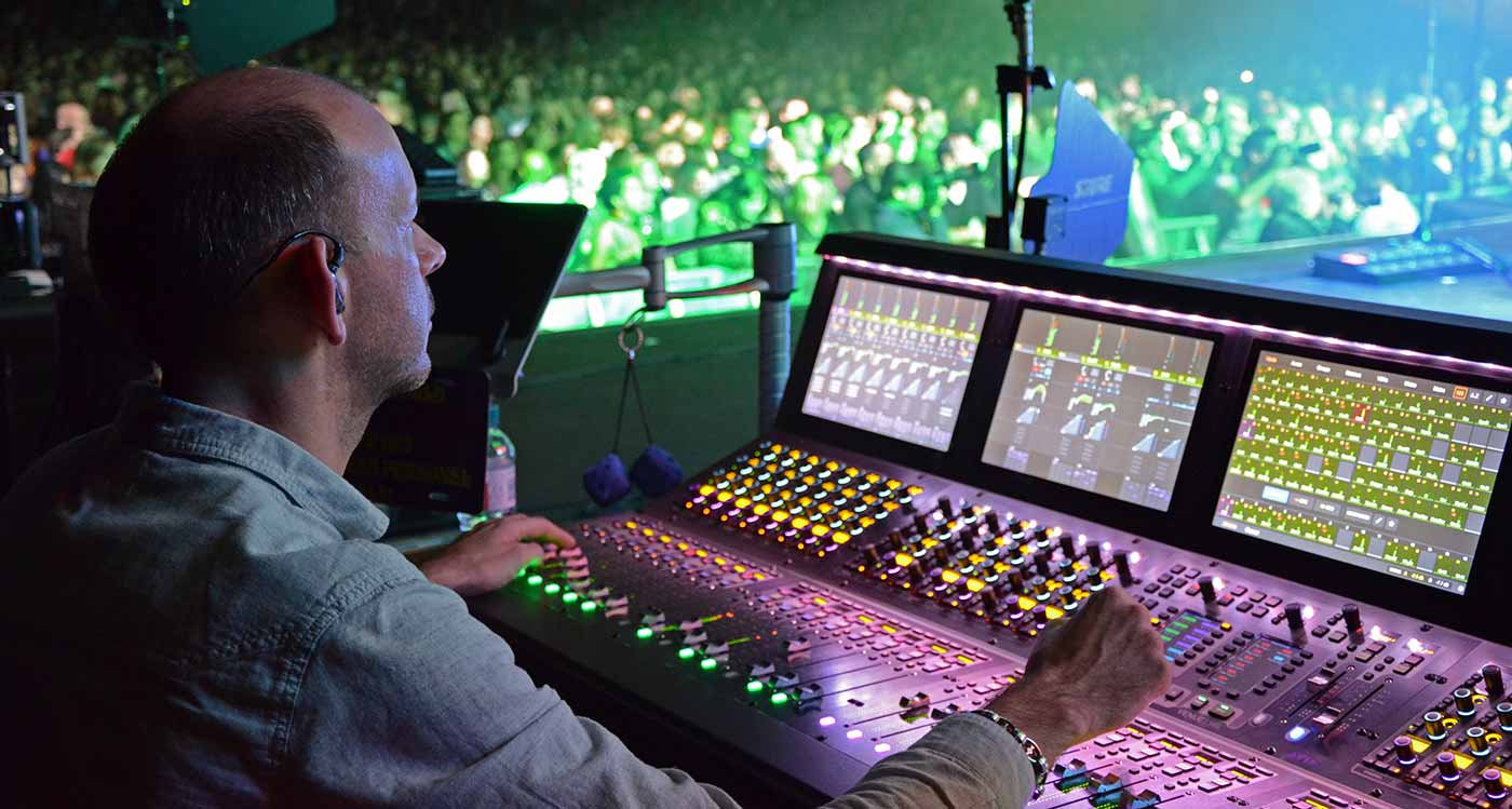 Charlie Bradley operating monitor mixing desk at a gig