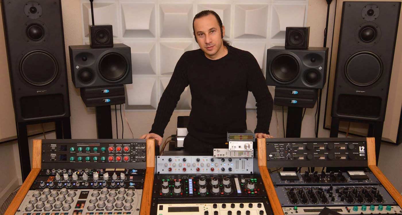 Maor Appelbaum stood behind mixing desk in between two large speakers