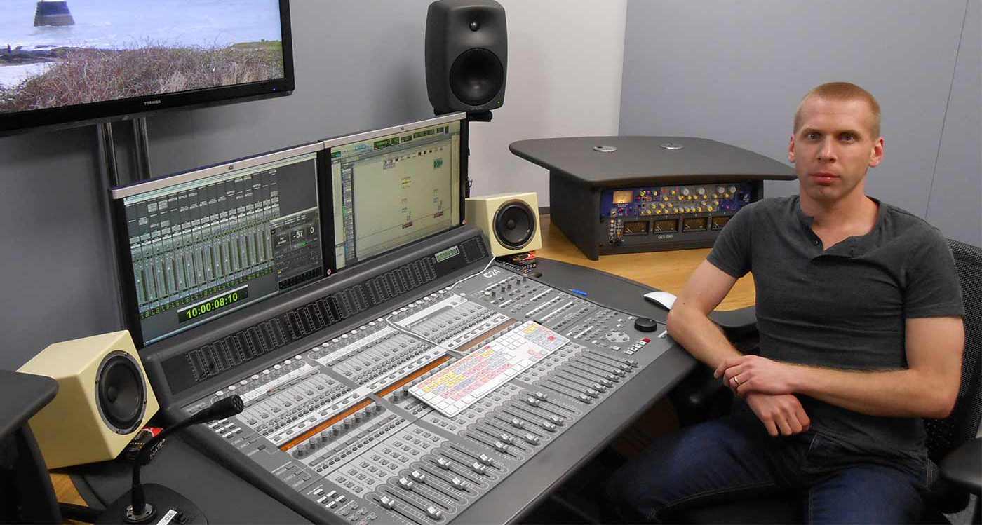 Matt Creed sat in post production studio with a pro tools session on screen