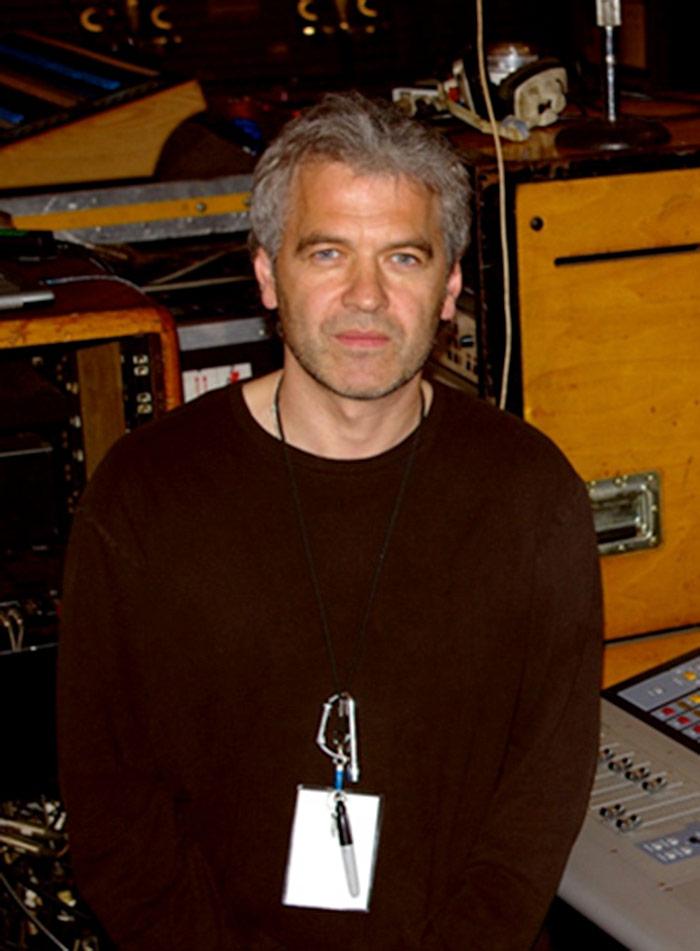 Rob Allan by a stage next to a live mixing console